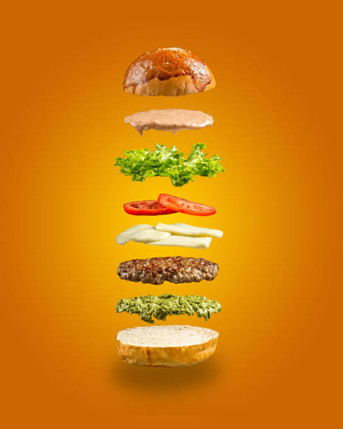 istock Floating burger ingredients on the yellow background 1468760055