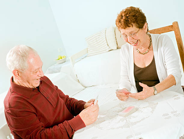 istock senior couple playing cards 146876029
