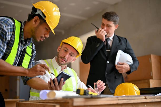istock Team of construction engineer and businessman working together in the construction site 1468767667