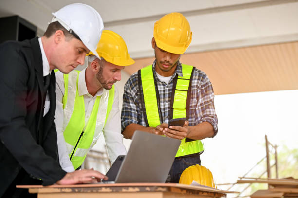 istock Professional caucasian male construction engineer manager working with an Asian foreman 1468767789
