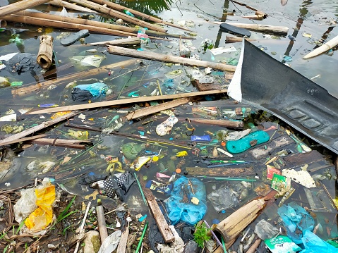 waste and garbage appear to fill the water area which can cause flooding and pollution
