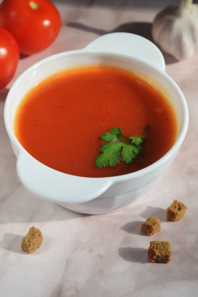 istock vertical still life from a plate with tomato soup, tomatoes, garlic and breadcrumbs 1468768847