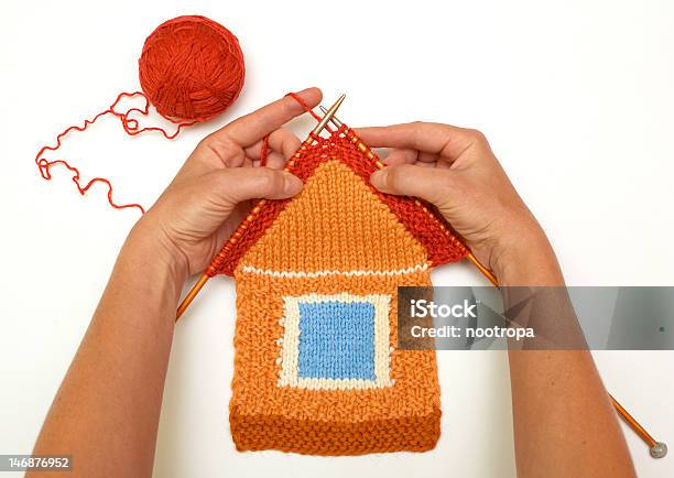 A Red And Orange Knitted House Stock Photo - Download Image Now - House, Knitting, Built Structure