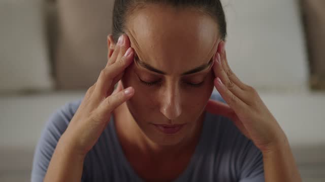 Woman experiencing debilitating headache