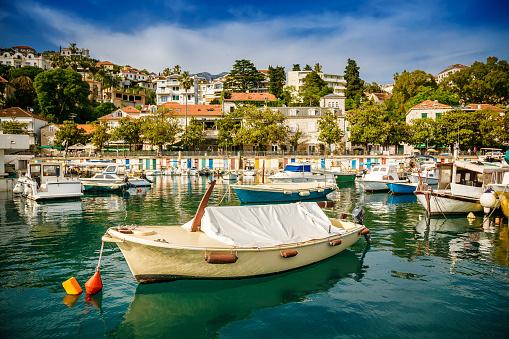 Beautiful view from water of a small port with old boats and yachts in Herceg Novi, Montenegro