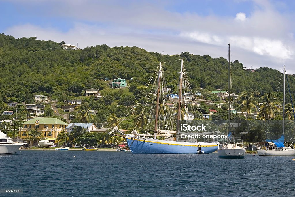 Admiralty Bay Boats moored in Admiralty Bay on the island of Bequia, St. Vincent and the Grenadines. Grenadines Stock Photo