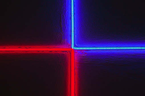 Red and blue laser neon light strips embedded on the wall