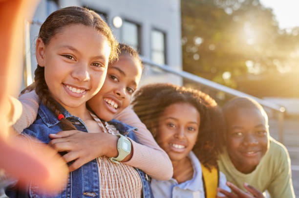 istock Girls, boy and bonding diversity selfie on community school, education or learning campus social media, about us or memory. Portrait, smile and happy children, students or friends in photography pov 1468774168