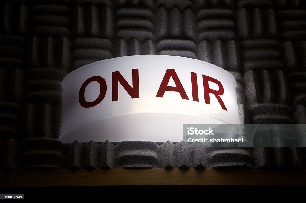 on air broadcasting sign on air broadcasting sign on a acoustic wall light is on and silence Mid-Air Stock Photo