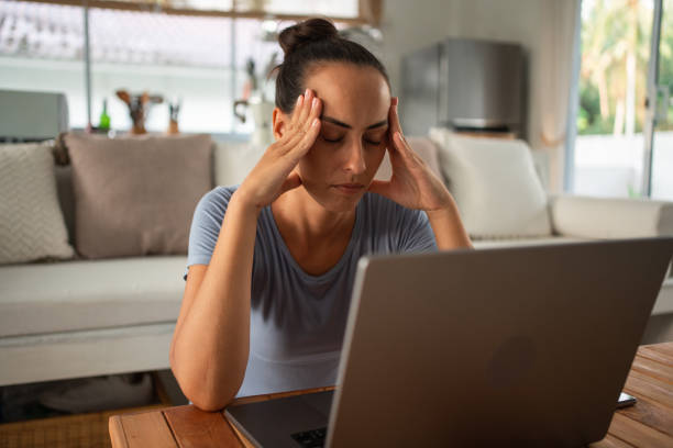 istock Woman suffers headache from excessive screen time 1468775964