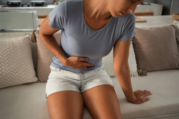 istock Woman experiences stomach pain 1468775997