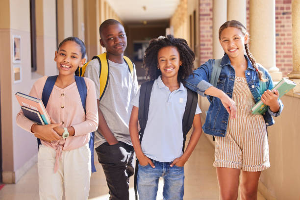 istock Education, school and children portrait for learning support, group project and diversity happiness in hall together. Studying, books and backpack of youth friends, students or kids in teamwork smile 1468776378