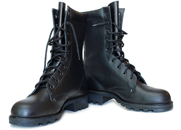 Two black leather army boots. stock photo