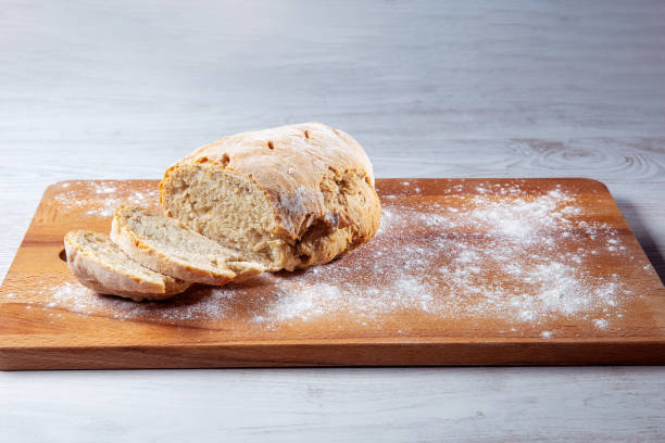 Free Stock Photo of Artisan bread on a wooden cutting board | Download ...