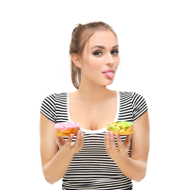 istock Funny girl  and colorful donuts. 1468792748