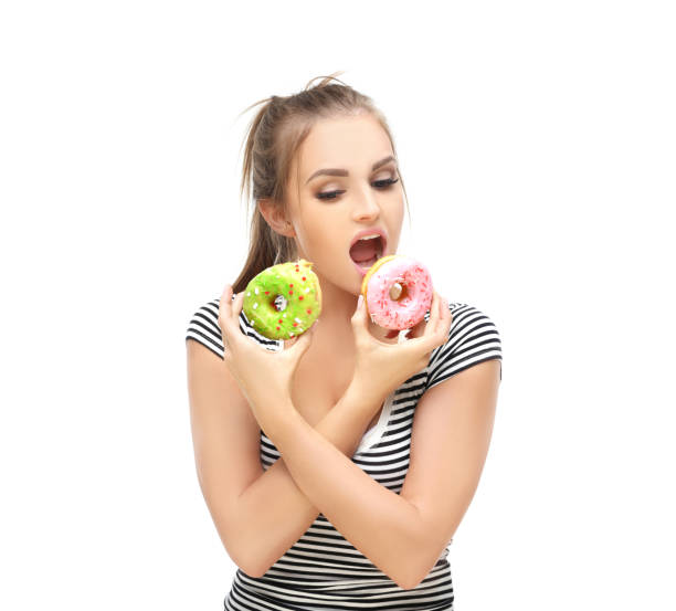 istock Funny girl  and colorful donuts. 1468792759