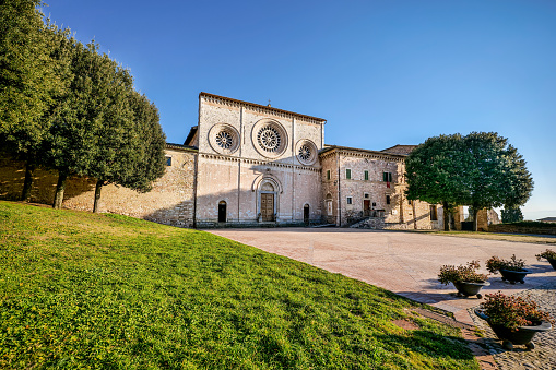 The harmonious facade of the Abbey Church of San Pietro in the medieval heart of Assisi in Umbria