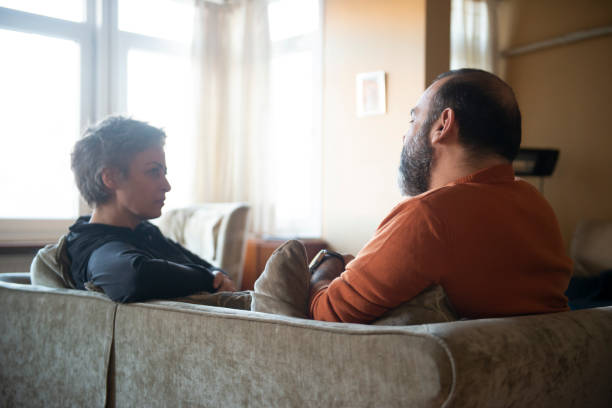 istock Happy couple relaxing at home 1468794986