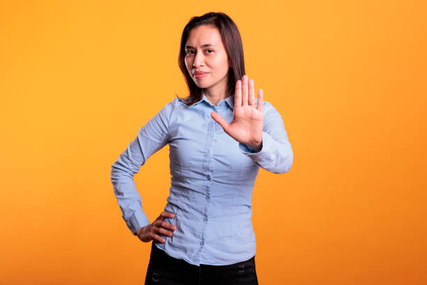 istock Serious filipino woman doing rejection gesture with hand 1468799233