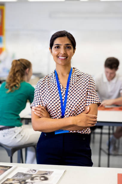 istock Female Teacher in her Classroom 1468800795