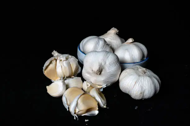 white garlic with black background, food and seasoning, garlic