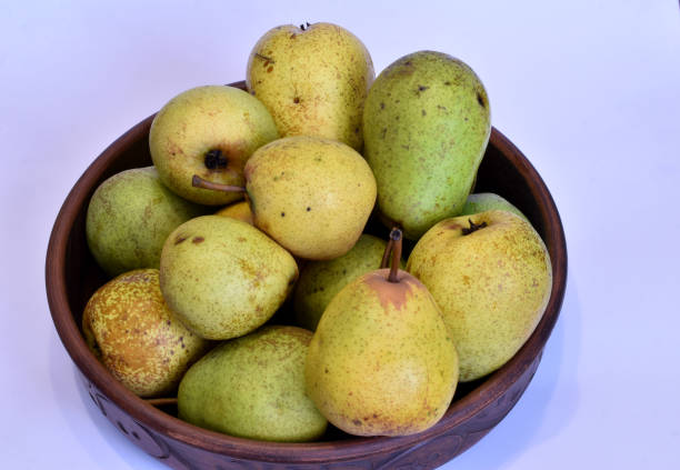 istock Ripe pears lie in a plate. 1468801397