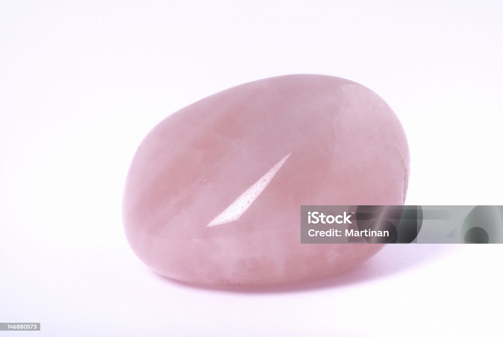 Rose quartz on white Rose quartz - semiprecious gem used for jewels and also in esoteric and alternative medicine Rose Quartz Stock Photo