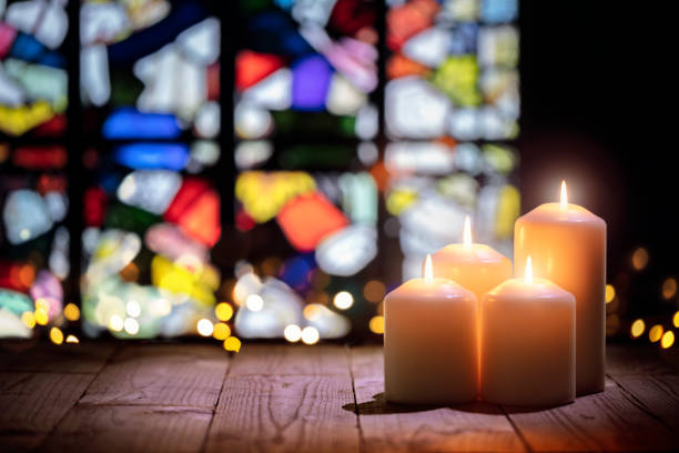 Candles in a church background stock photo