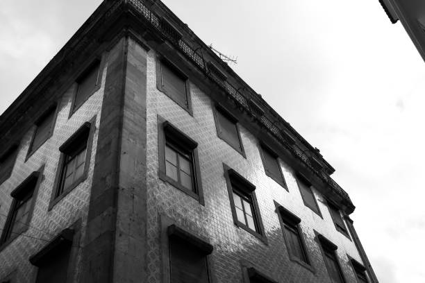istock Typical vintage portuguese facade with white windows 1468807846