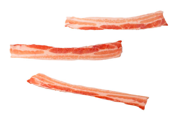 istock Raw bacon slices isolated on a white background. 1468811303