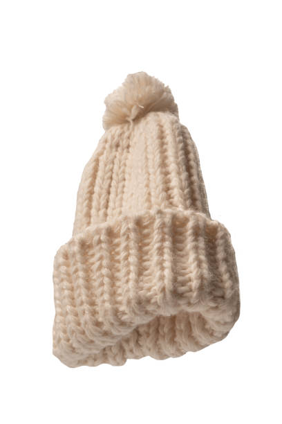 istock Beige beanie hat with pom pom isolated on a white background. 1468811367