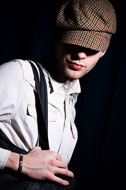 Fashion man in peaked cap stock photo