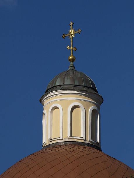 istock golden cross on a sky 146881567