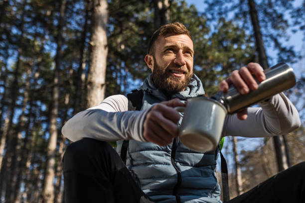 istock Smiling hiker in nature taking a break 1468817669