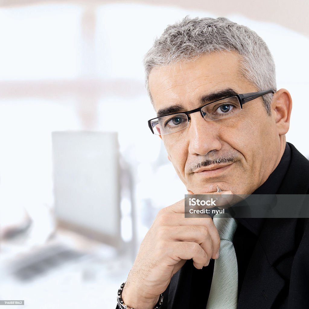 Mature businessman thinking Mature gray haired creative looking businessman thinking. Click here for more business photos:   50-54 Years Stock Photo