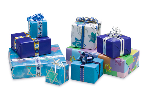 eight Star of David wrapped Hanukkah gifts and presents on isolated background