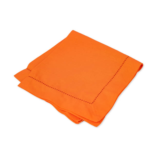istock Folded orange tissue napkin isolated over white background 1468824521
