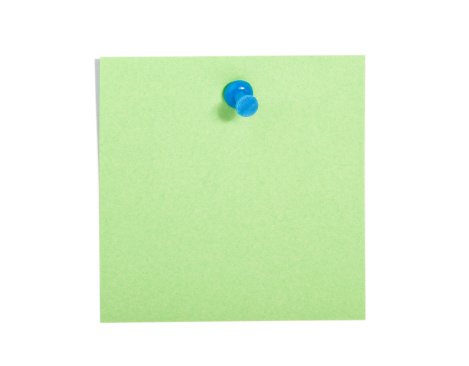 Green  reminder note with blue pin on white background