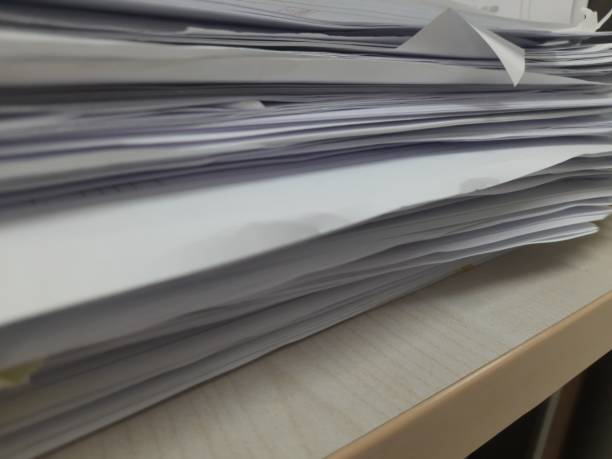 istock pile of papers on the table 1468826203