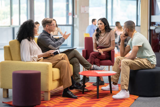 istock Businessman talking with colleagues 1468829976