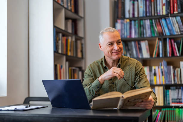 istock High School Teacher in a Library 1468829992