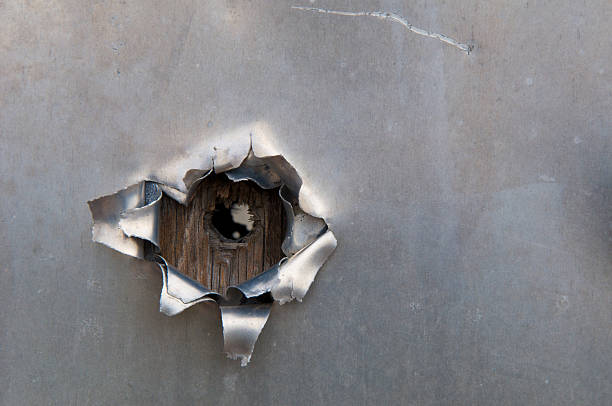 istock Bullet hole in aluminum 146883171
