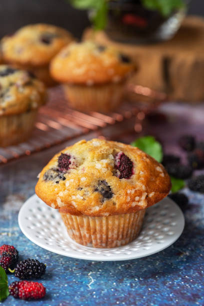 istock ffreshly baked homemade mulberry muffins. 1468832257