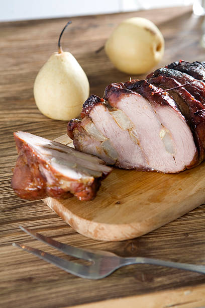 istock bake pork roll with pear on wood plate 146883274