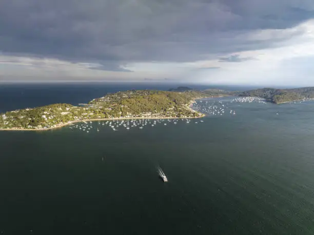 Photo of High angle aerial evening drone view of Palm Beach, Whale Beach and Stokes Point (Avalon), all affluent beachside suburbs in the Northern Beaches region of Sydney, New South Wales, Australia.