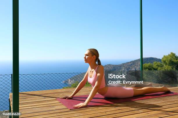 Young Woman Does Yoga In Solitude Stock Photo - Download Image Now - 20-24 Years, Active Lifestyle, Adult