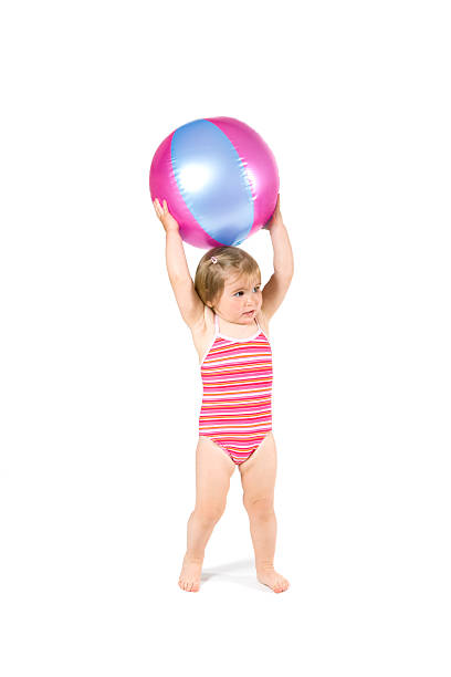 istock Baby playing with beach ball 146883558