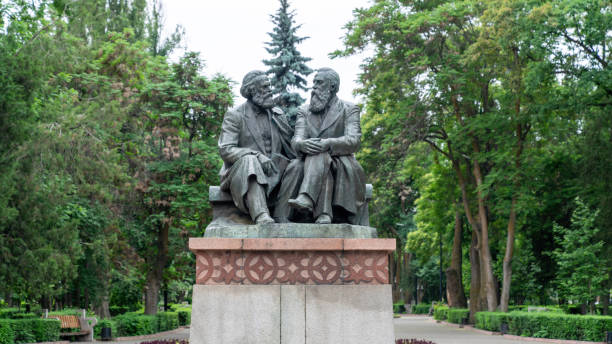 Statues of Karl Marx and Friedrich Engels in Bishkek, Kyrgyzstan Bishkek, Kyrgyzstan - May 2022: Monument from Soviet era, statues of Karl Marx and Friedrich Engels marxism stock pictures, royalty-free photos & images