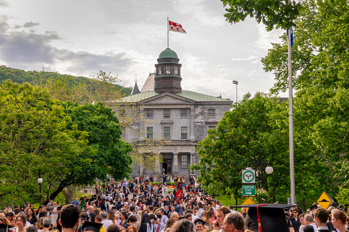 Crowd on McGill university campus on graduation day in spring, in Montreal Quebec, Canada