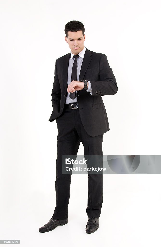 Uomo d'affari guardando che ora è, isolato su sfondo bianco - Foto stock royalty-free di Abbigliamento